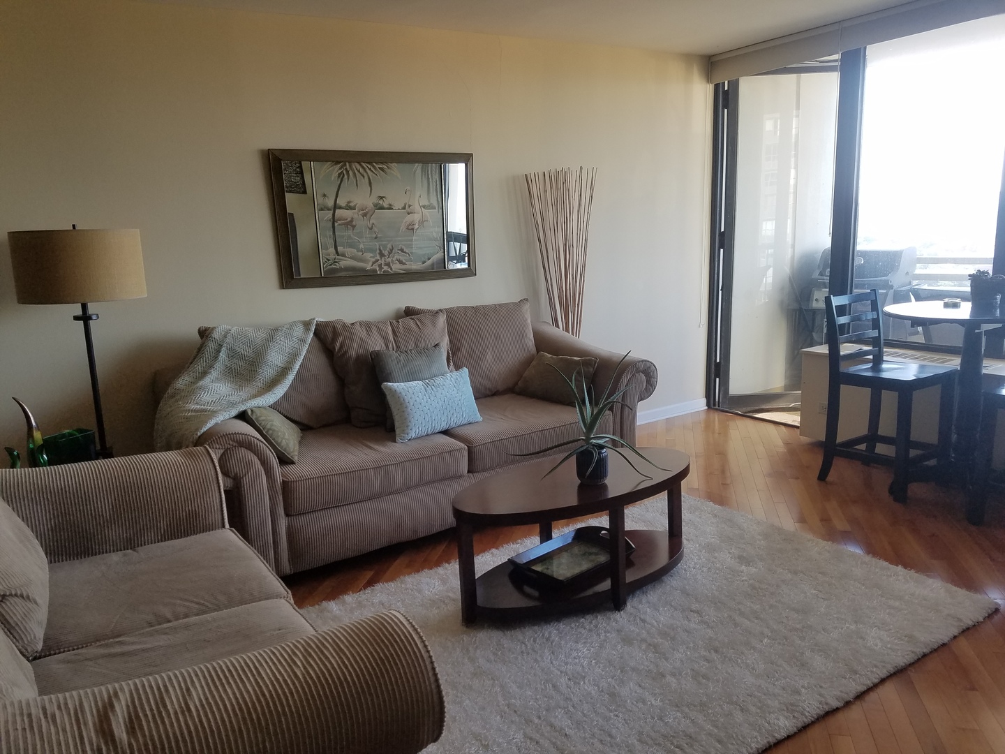 Undisclosed Address Chicago, IL 60613 - Photo 14 of 16 a living room with furniture and a wooden floor