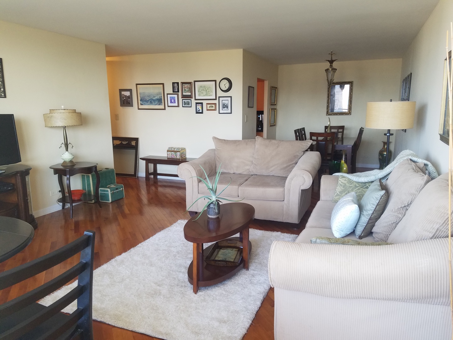 Undisclosed Address Chicago, IL 60613 - Photo 2 of 16 a living room with furniture and wooden floor