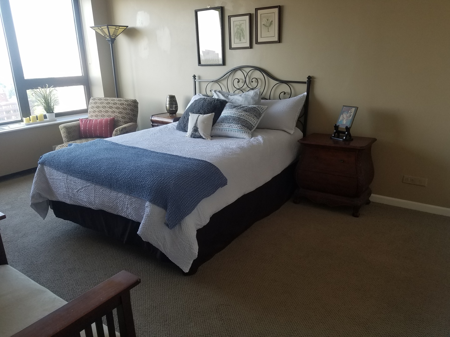 Undisclosed Address Chicago, IL 60613 - Photo 7 of 16 a bed sitting in a bedroom next to a window