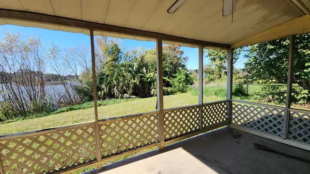 a view of a yard with a tree
