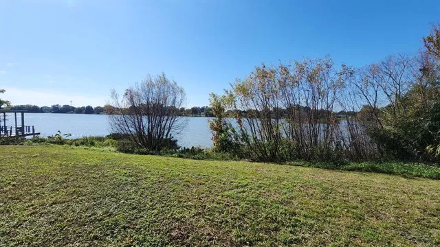 a view of a kitchen with a sink and a kitchen island