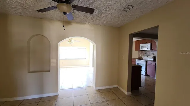 a kitchen with a stove and a microwave
