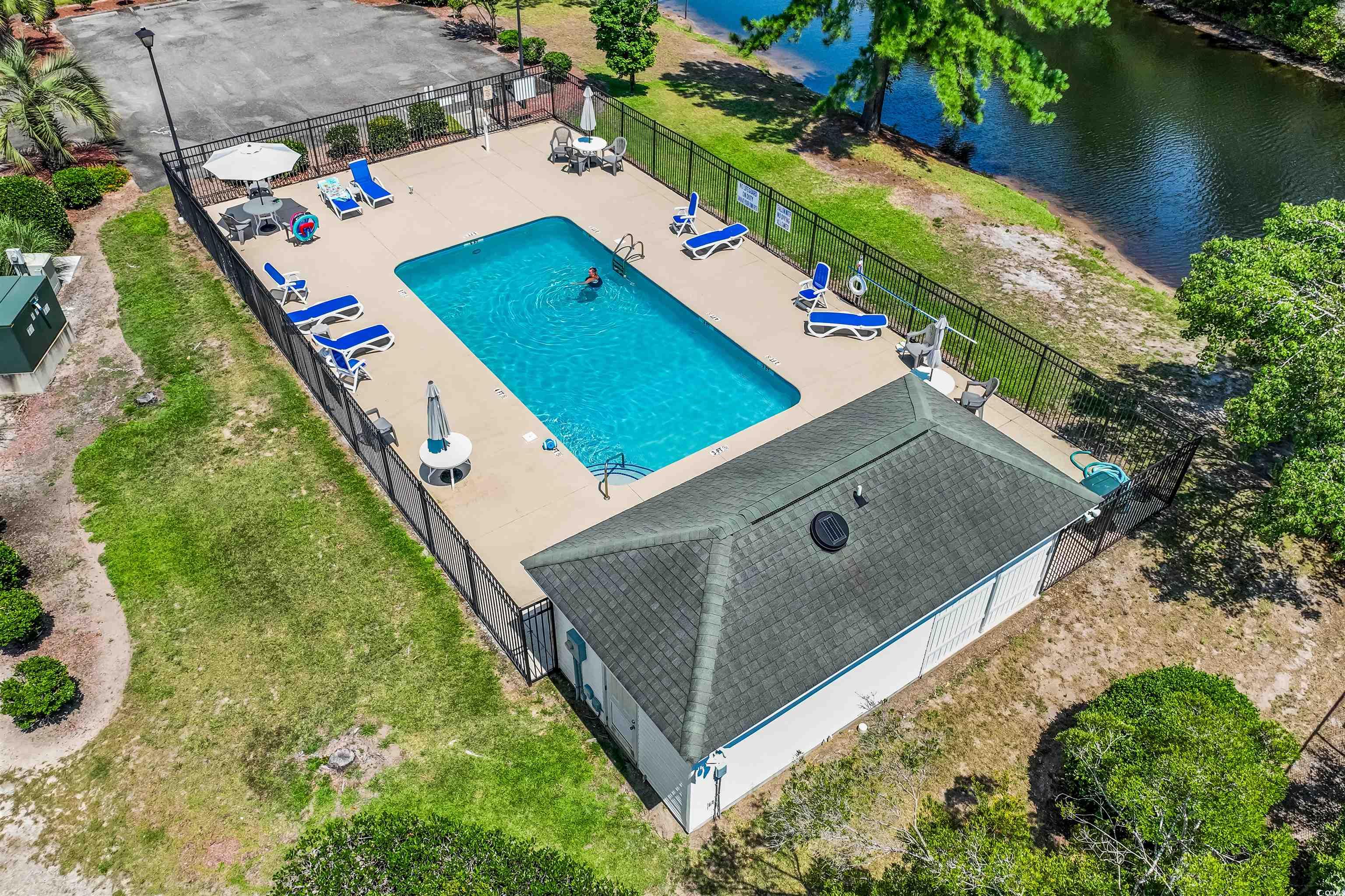 2627 Corn Pile Road Myrtle Beach, SC 29588 - Photo 39 of 40 View of swimming pool featuring a patio, a water v