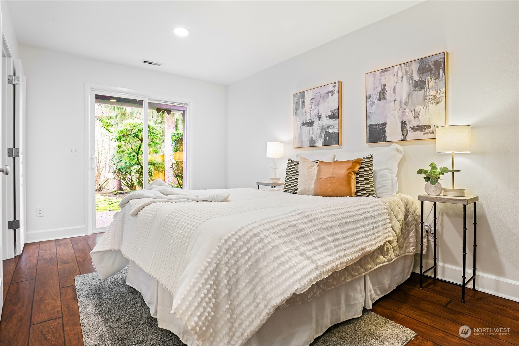 23303 8th Place West Bothell, WA 98021 - Photo 21 of 33 a bedroom with a bed and wooden floor