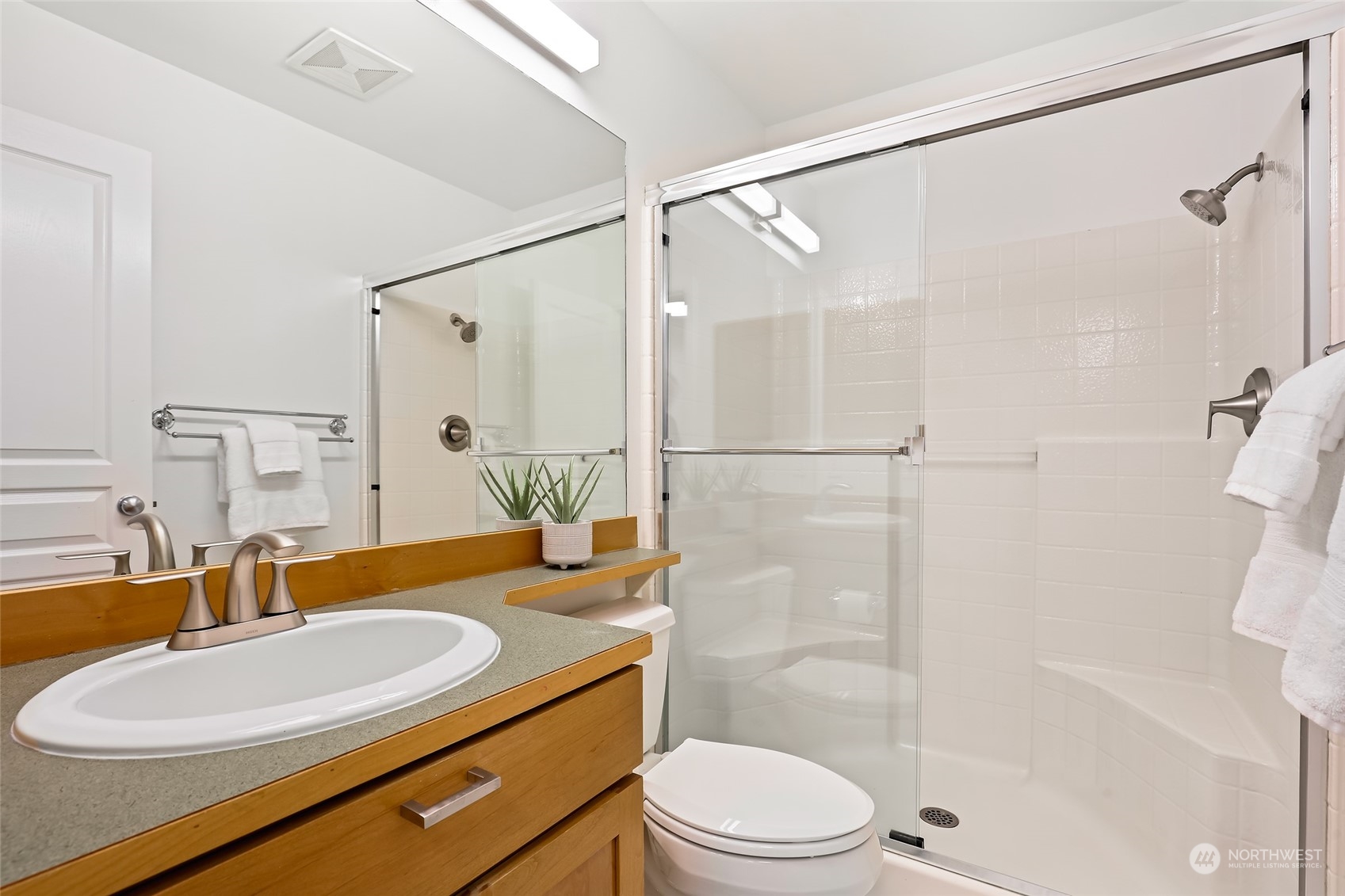 23303 8th Place West Bothell, WA 98021 - Photo 22 of 33 a bathroom with a sink a toilet and shower
