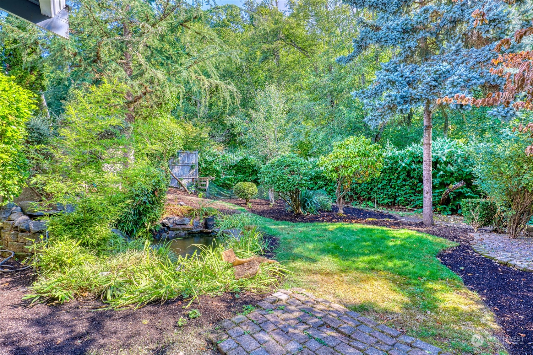 23303 8th Place West Bothell, WA 98021 - Photo 25 of 33 a backyard of a house with lots of green space
