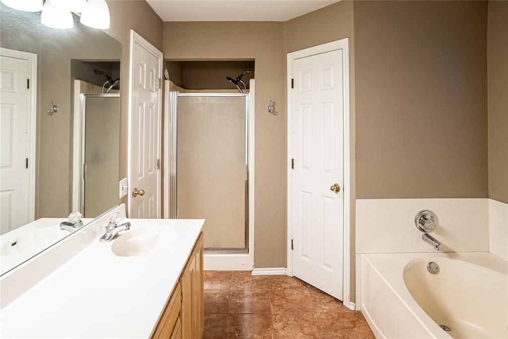 604 Valleyridge Court Decatur, TX 76234 - Photo 17 of 23 Primary bath with Garden Tub and separate stand up shower