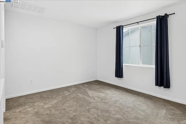 an empty room with closet area