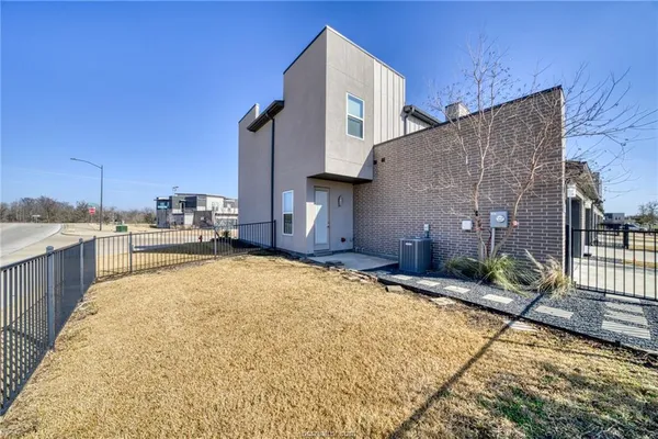 a house view with a backyard space