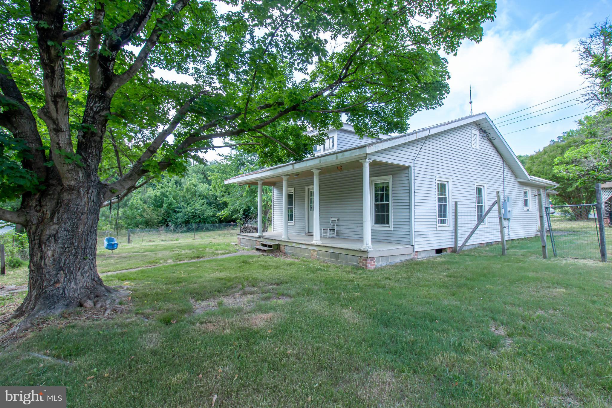 198 Mt Hope Church Road Bumpass, VA 23024 - Photo 6 of 25 a view of a house with a backyard