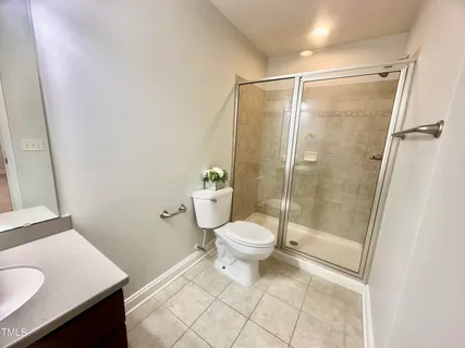 a bathroom with a toilet sink and a shower