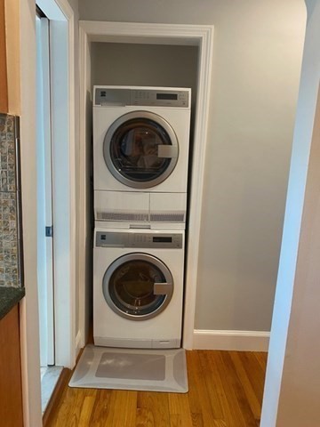 116 Floral Street, Unit 6 Newton, MA 02461 - Photo 11 of 12 a view of a hallway with washer and dryer