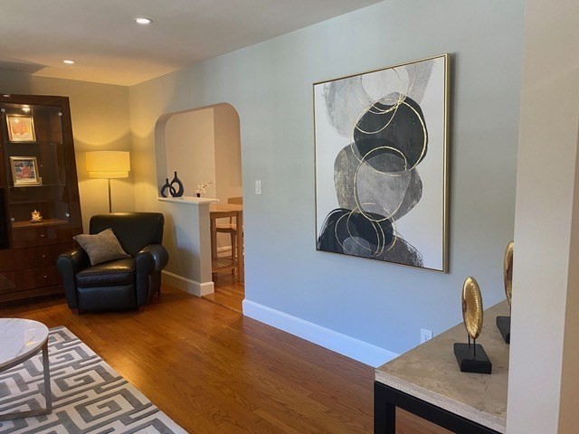 116 Floral Street, Unit 6 Newton, MA 02461 - Photo 4 of 12 a living room with furniture and a wooden floor