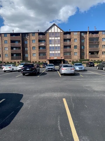 a view of a car park in front of a building
