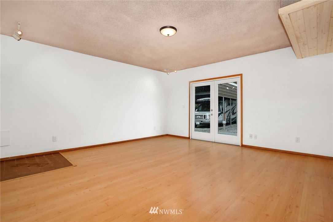 22936 Southeast 288th Street Maple Valley, WA 98038 - Photo 12 of 26 a view of an empty room with a window