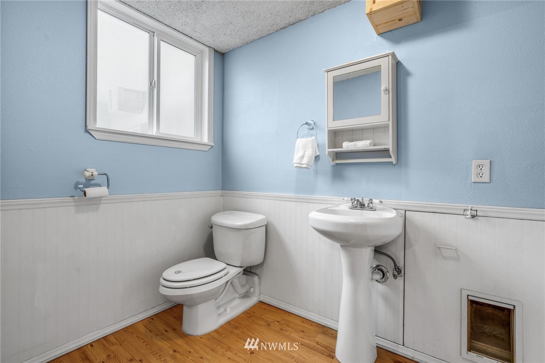 22936 Southeast 288th Street Maple Valley, WA 98038 - Photo 13 of 26 a bathroom with a toilet sink and mirror