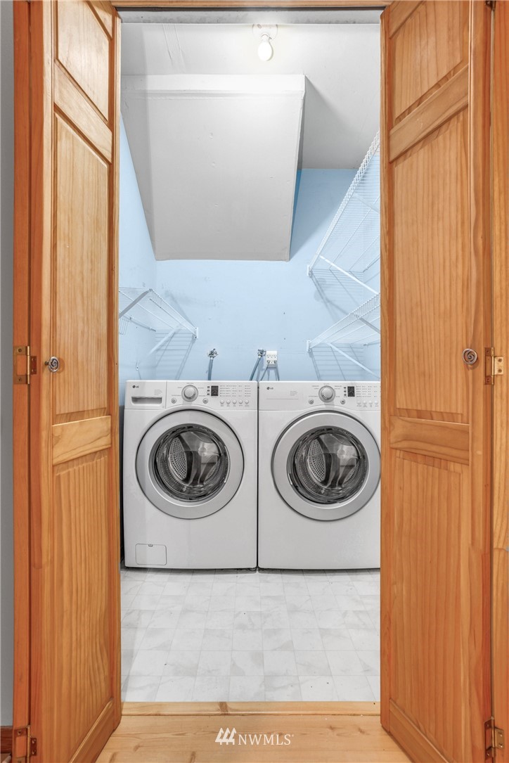 22936 Southeast 288th Street Maple Valley, WA 98038 - Photo 14 of 26 a utility room with dryer and washer