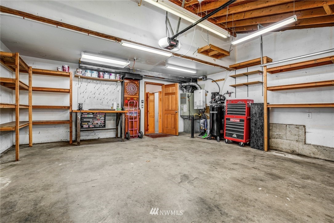 22936 Southeast 288th Street Maple Valley, WA 98038 - Photo 16 of 26 a view of walk in closet with clothes
