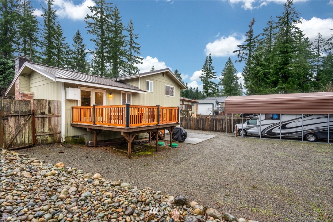 22936 Southeast 288th Street Maple Valley, WA 98038 - Photo 24 of 26 a view of a house with a yard and sitting area