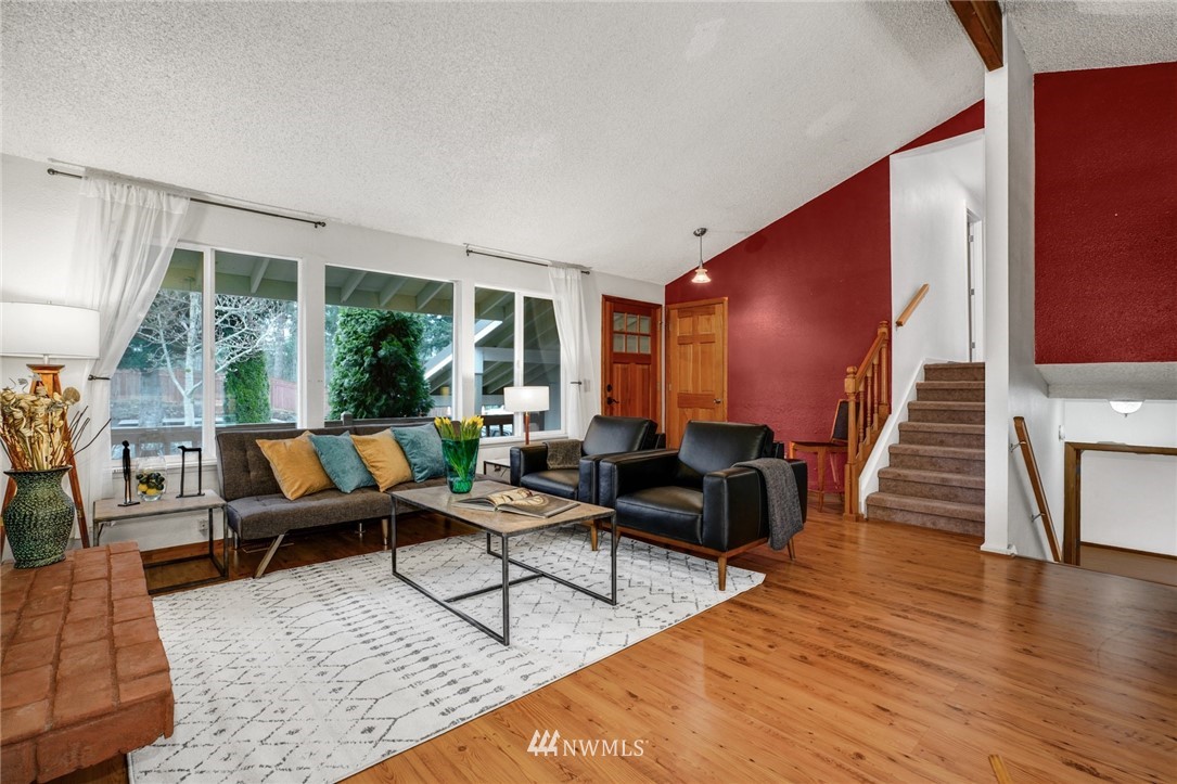 22936 Southeast 288th Street Maple Valley, WA 98038 - Photo 4 of 26 a living room with furniture and wooden floor