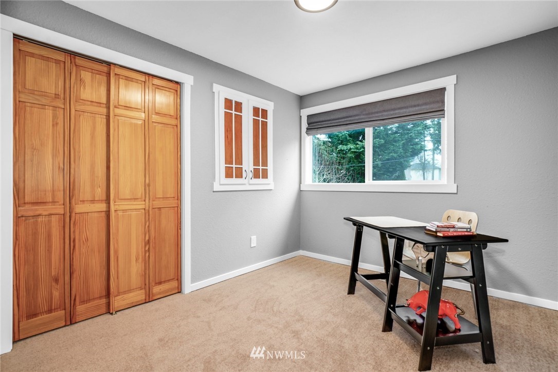 22936 Southeast 288th Street Maple Valley, WA 98038 - Photo 10 of 26 a view of a livingroom with furniture and a window