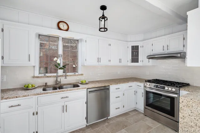 a wooden fence with some plants