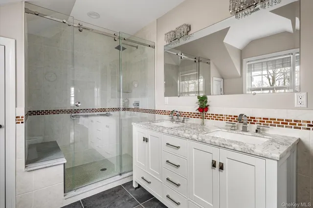 an aerial view of a house with a yard and large trees