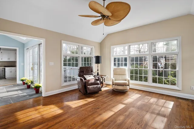 a kitchen with granite countertop a stove a sink and a refrigerator