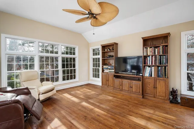 a kitchen with cabinets stainless steel appliances a sink and a window