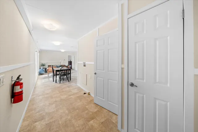 a bedroom with a bed and a mirror