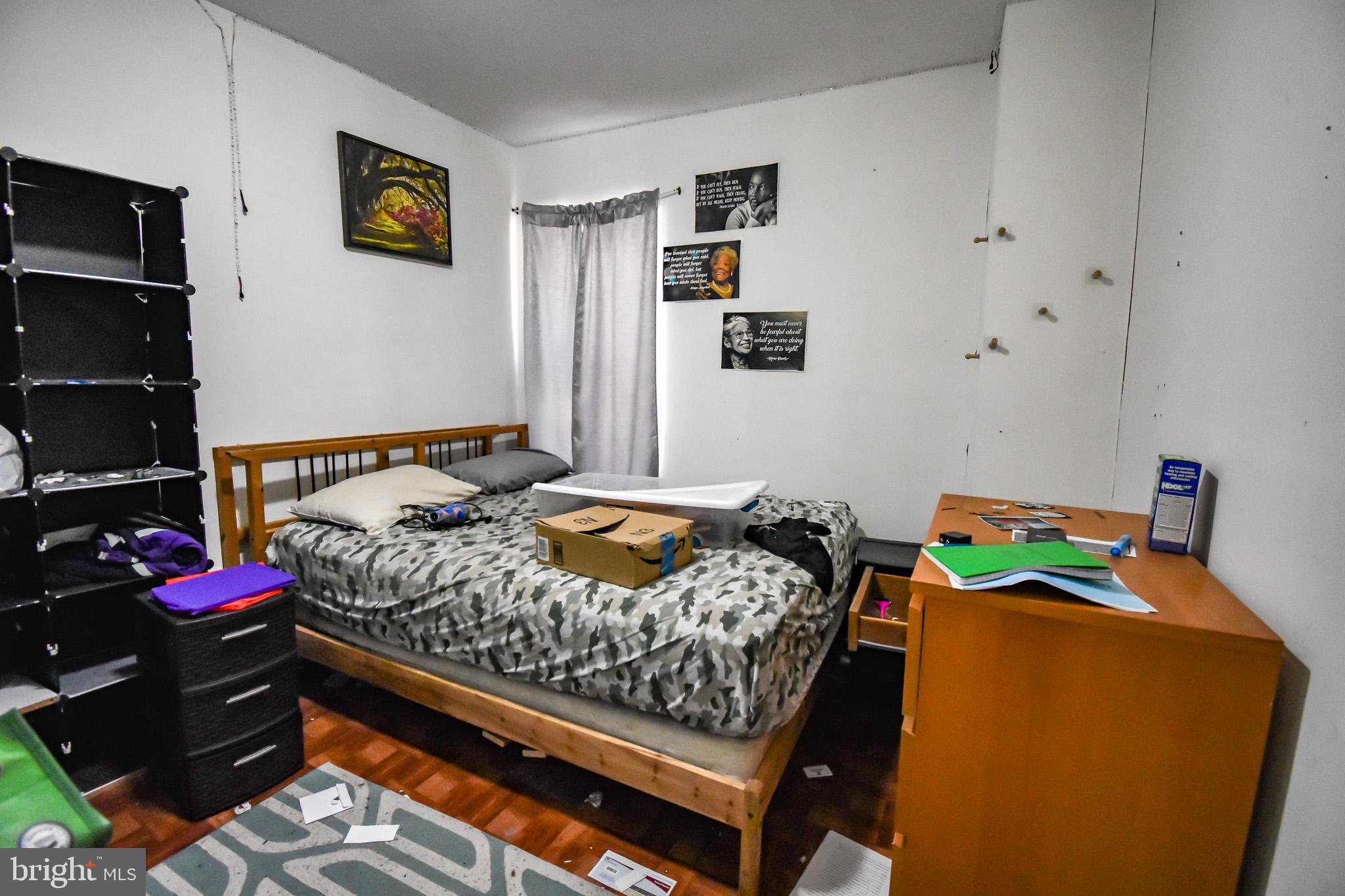1921 Rhode Island Avenue Northeast Washington, DC 20018 - Photo 11 of 23 a bedroom with a bed and dresser