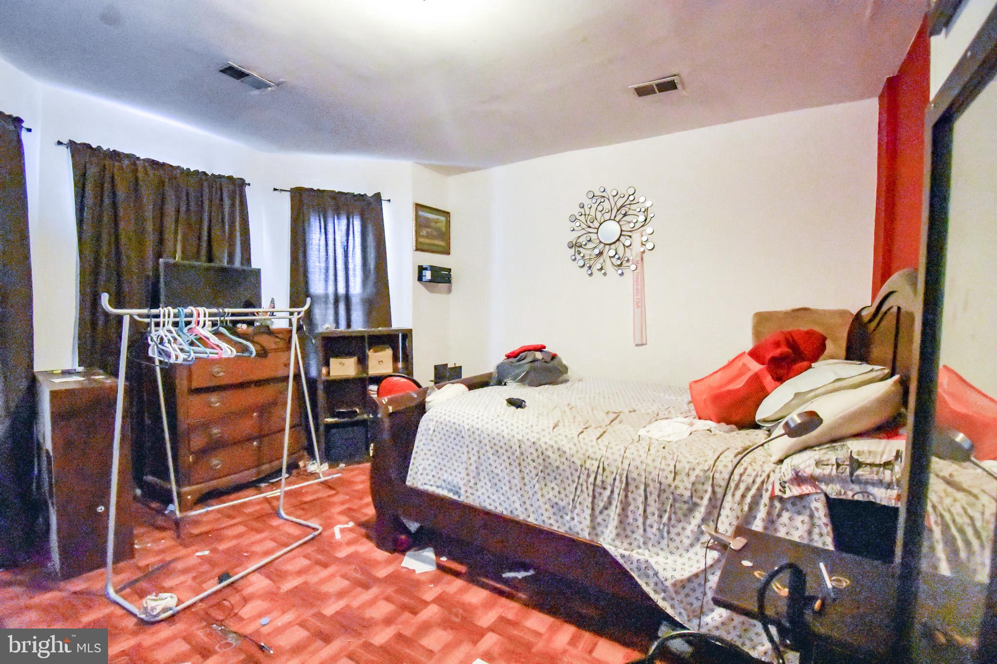 1921 Rhode Island Avenue Northeast Washington, DC 20018 - Photo 12 of 23 a bedroom with a bed and a window