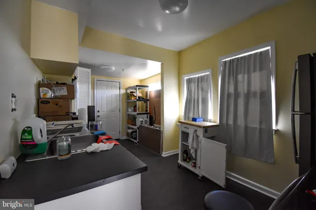 a room with furniture a window and gym equipment