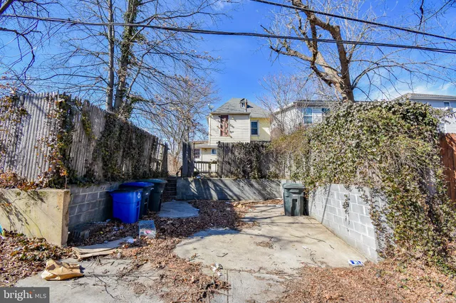 a view of a house with snow on the road