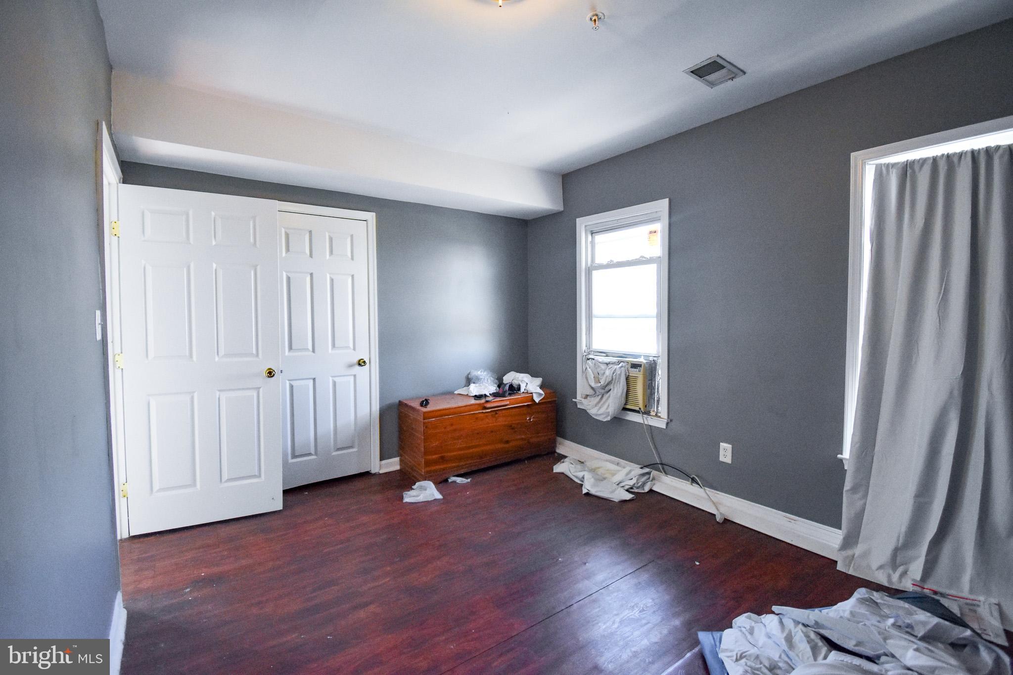 1921 Rhode Island Avenue Northeast Washington, DC 20018 - Photo 9 of 23 wooden floor and windows in a room