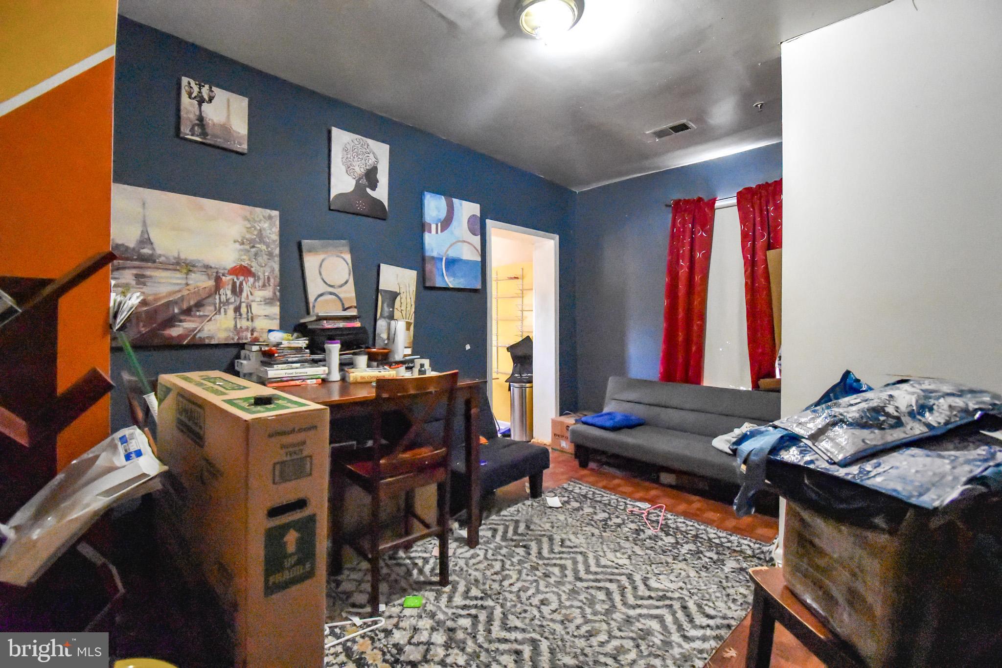 1921 Rhode Island Avenue Northeast Washington, DC 20018 - Photo 10 of 23 a living room with furniture and a dining table