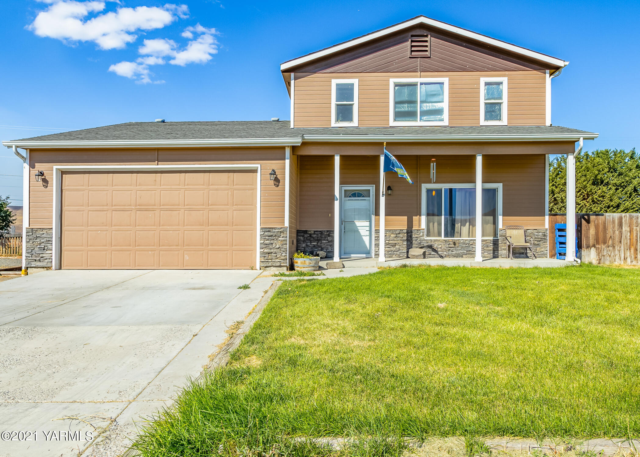front view of a house with a yard