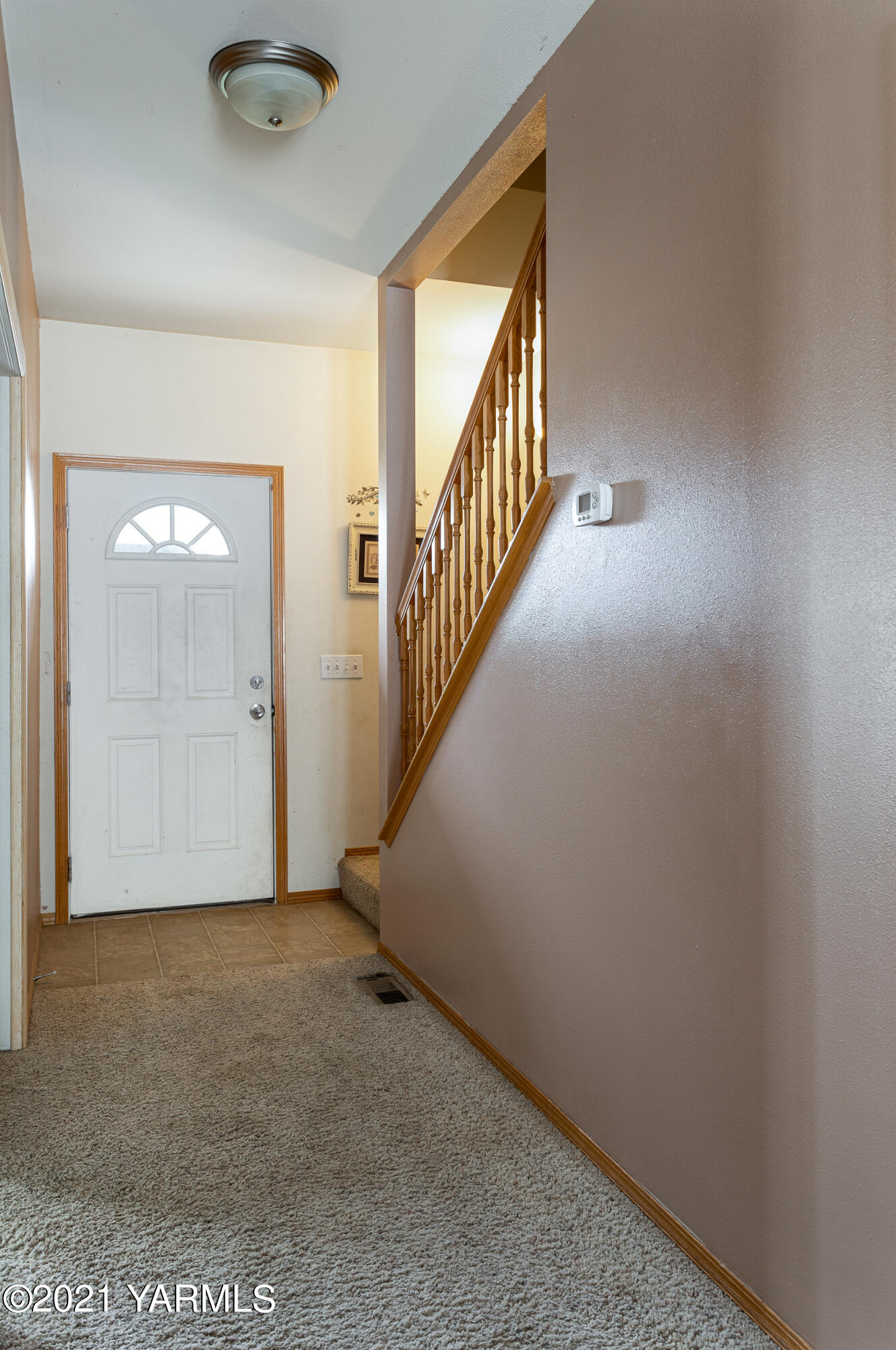 391 Sheep Company Road Selah, WA 98942 - Photo 5 of 26 a view of an empty room with stairs