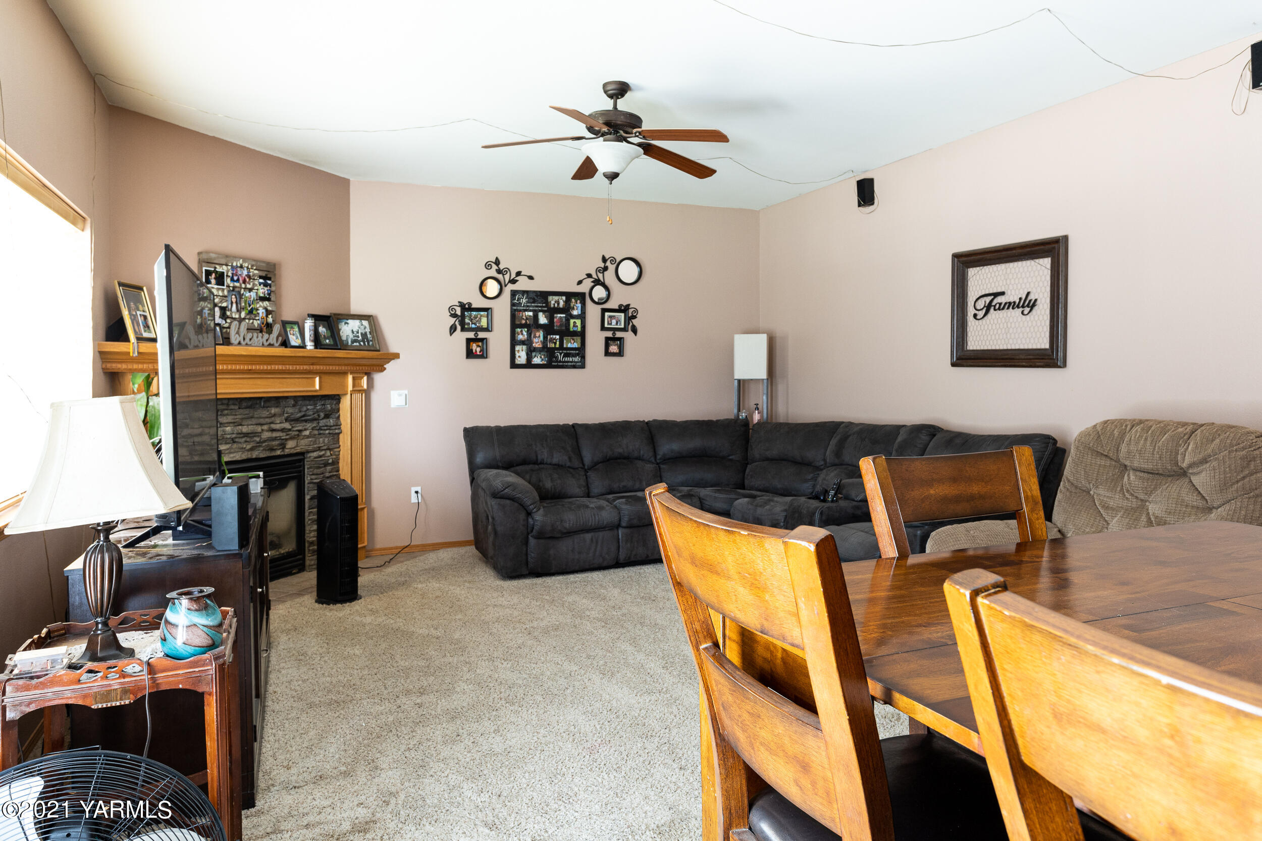 391 Sheep Company Road Selah, WA 98942 - Photo 8 of 26 a living room with furniture and a fireplace