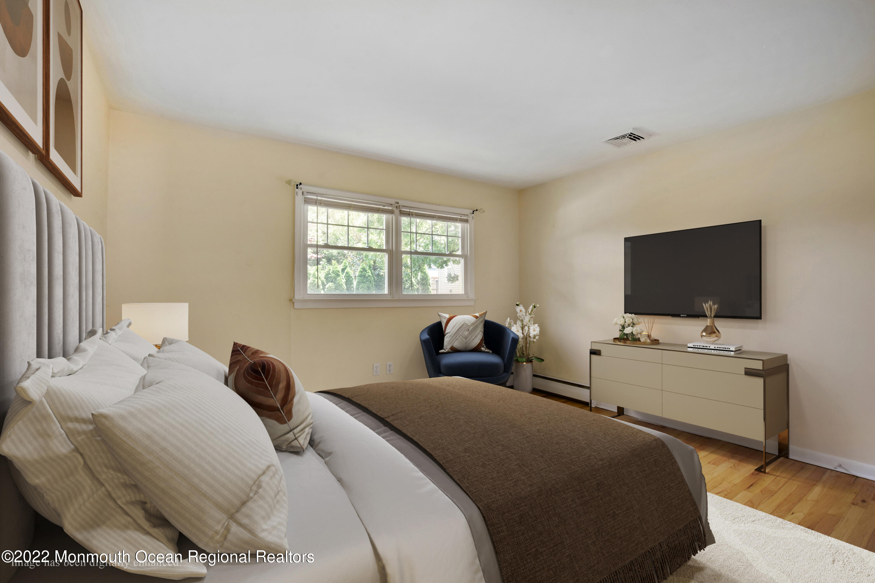 3301 B River Road Point Pleasant, NJ 08742 - Photo 10 of 20 a bedroom with a bed and a flat screen tv