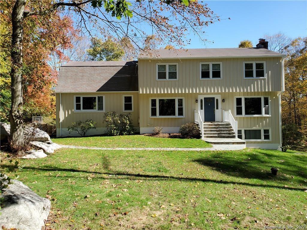 208 Guinea Road Stamford, CT 06903 - Photo 1 of 1 a front view of a house with a garden