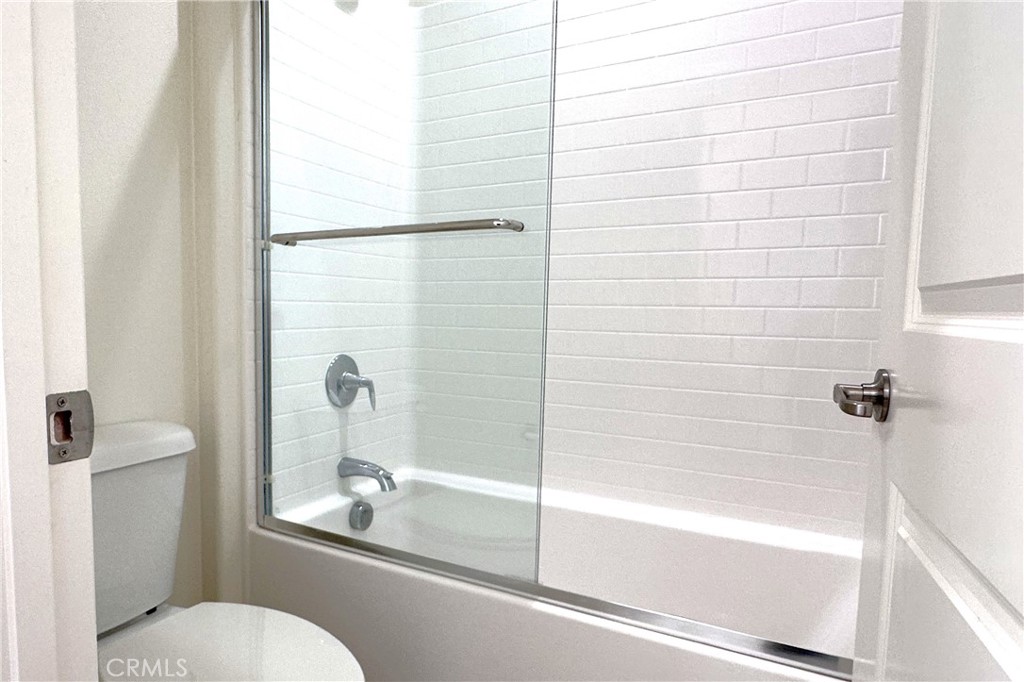 9318 Hellman Avenue, Unit 4 Rancho Cucamonga, CA 91730 - Photo 14 of 28 a bathroom with a shower and a toilet