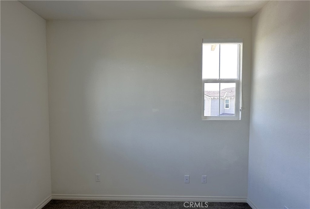 9318 Hellman Avenue, Unit 4 Rancho Cucamonga, CA 91730 - Photo 15 of 28 an empty room with a window