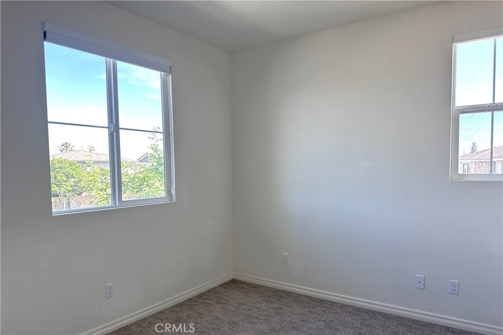 9318 Hellman Avenue, Unit 4 Rancho Cucamonga, CA 91730 - Photo 16 of 28 an empty room with a window