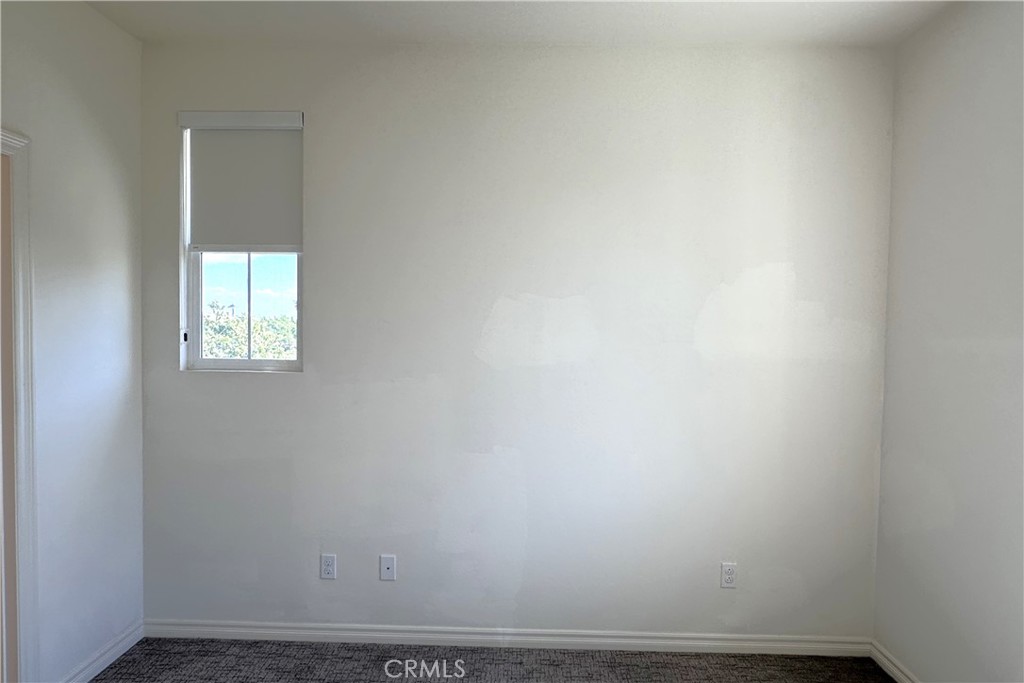 9318 Hellman Avenue, Unit 4 Rancho Cucamonga, CA 91730 - Photo 19 of 28 a view of an empty room and window
