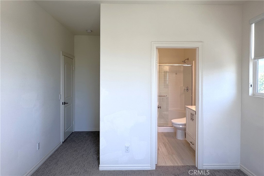 9318 Hellman Avenue, Unit 4 Rancho Cucamonga, CA 91730 - Photo 20 of 28 a bathroom with a toilet