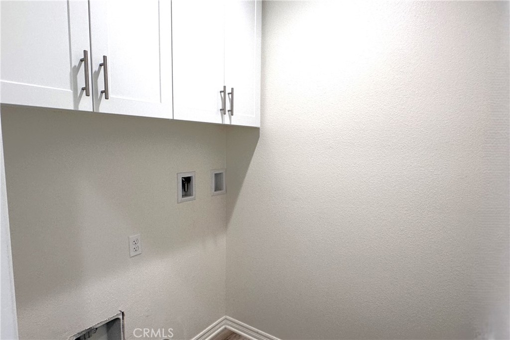 9318 Hellman Avenue, Unit 4 Rancho Cucamonga, CA 91730 - Photo 6 of 28 a view of a microwave and cabinets