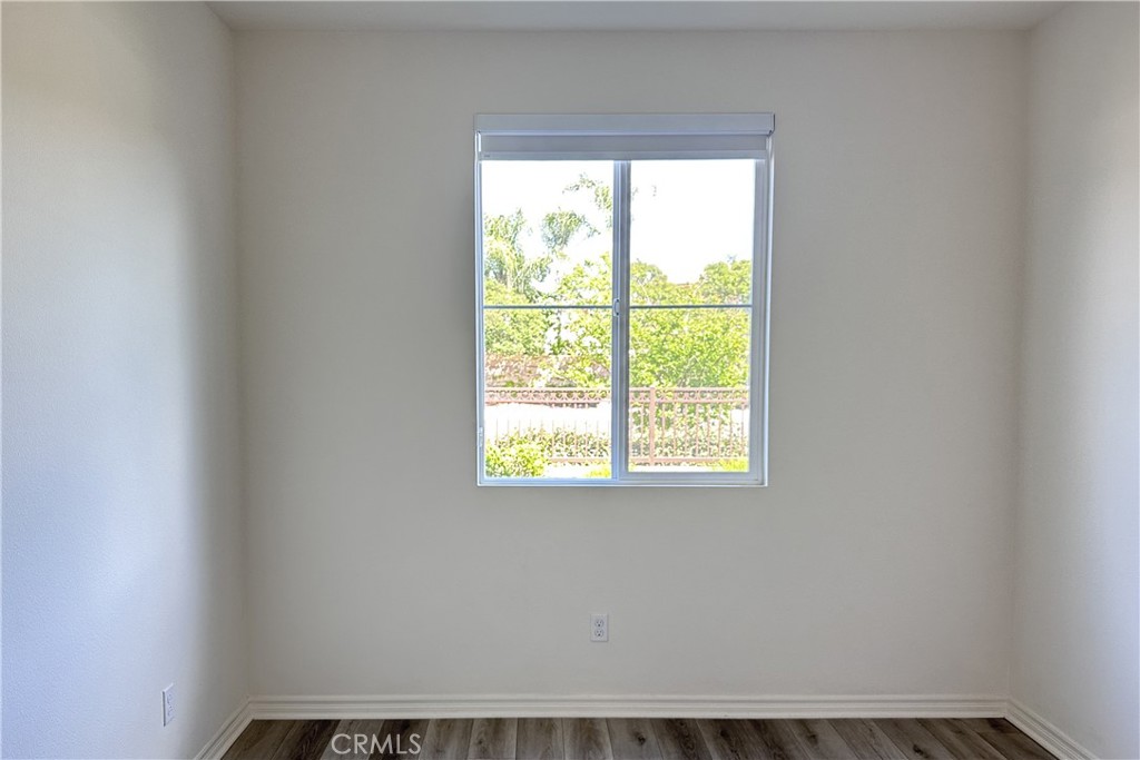9318 Hellman Avenue, Unit 4 Rancho Cucamonga, CA 91730 - Photo 8 of 28 an empty room with a window