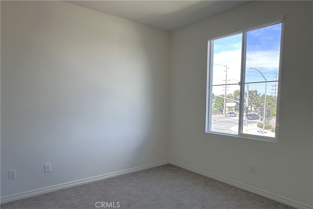 9318 Hellman Avenue, Unit 4 Rancho Cucamonga, CA 91730 - Photo 10 of 28 an empty room with a window