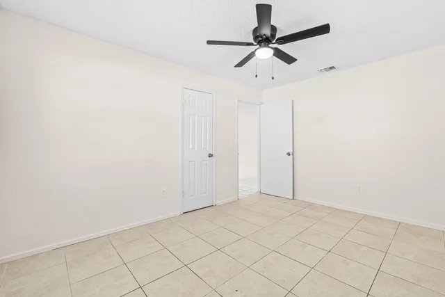 a view of storage and utility room with racks on the wall